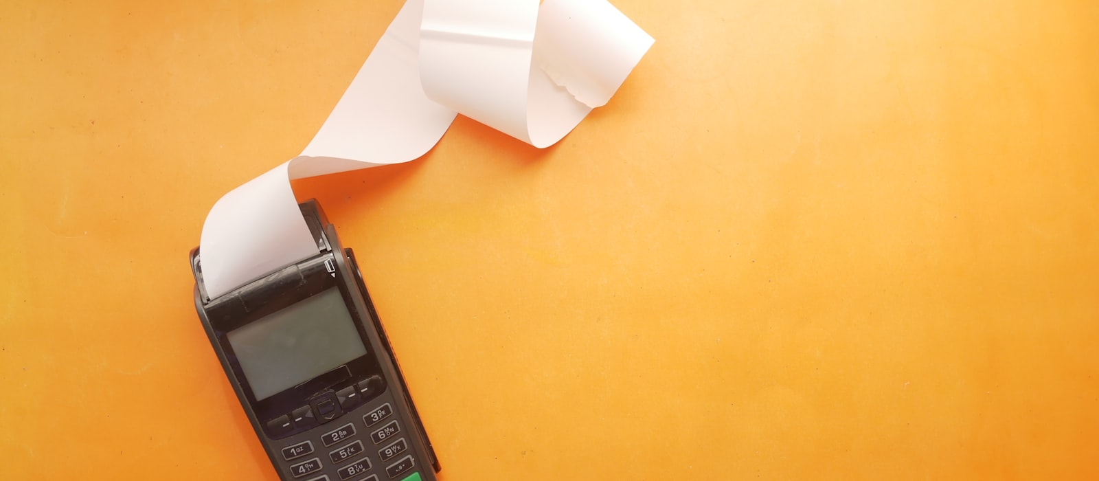 A card terminal printing a receipt.