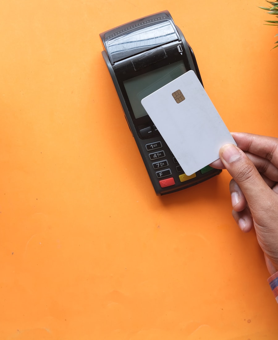 A payment card going into a card terminal.
